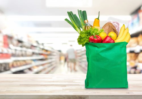 shopping-bag-with-food-groceries-table-supermarket_8087-1414